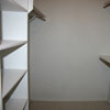 Closet for the master bedroom in the Watauga rental property. It includes lots of builtin shelving.